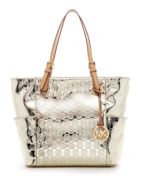 do real michael kors purses have mk logo in gold|Michael Kors gold tote handbags.